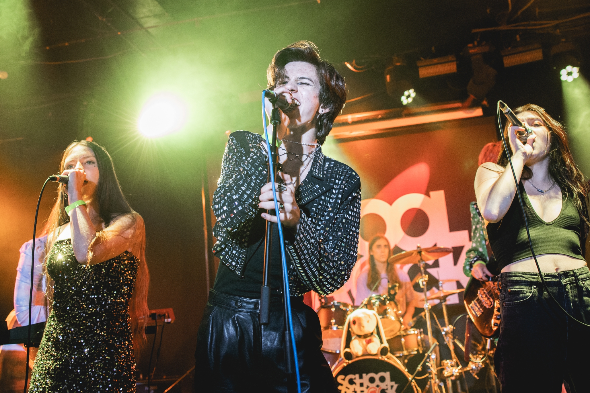 AllStar students singing together on stage