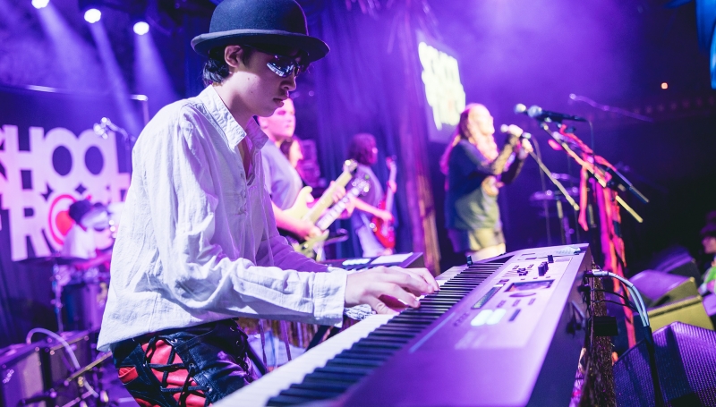 School of Rock Student Performing on Stage